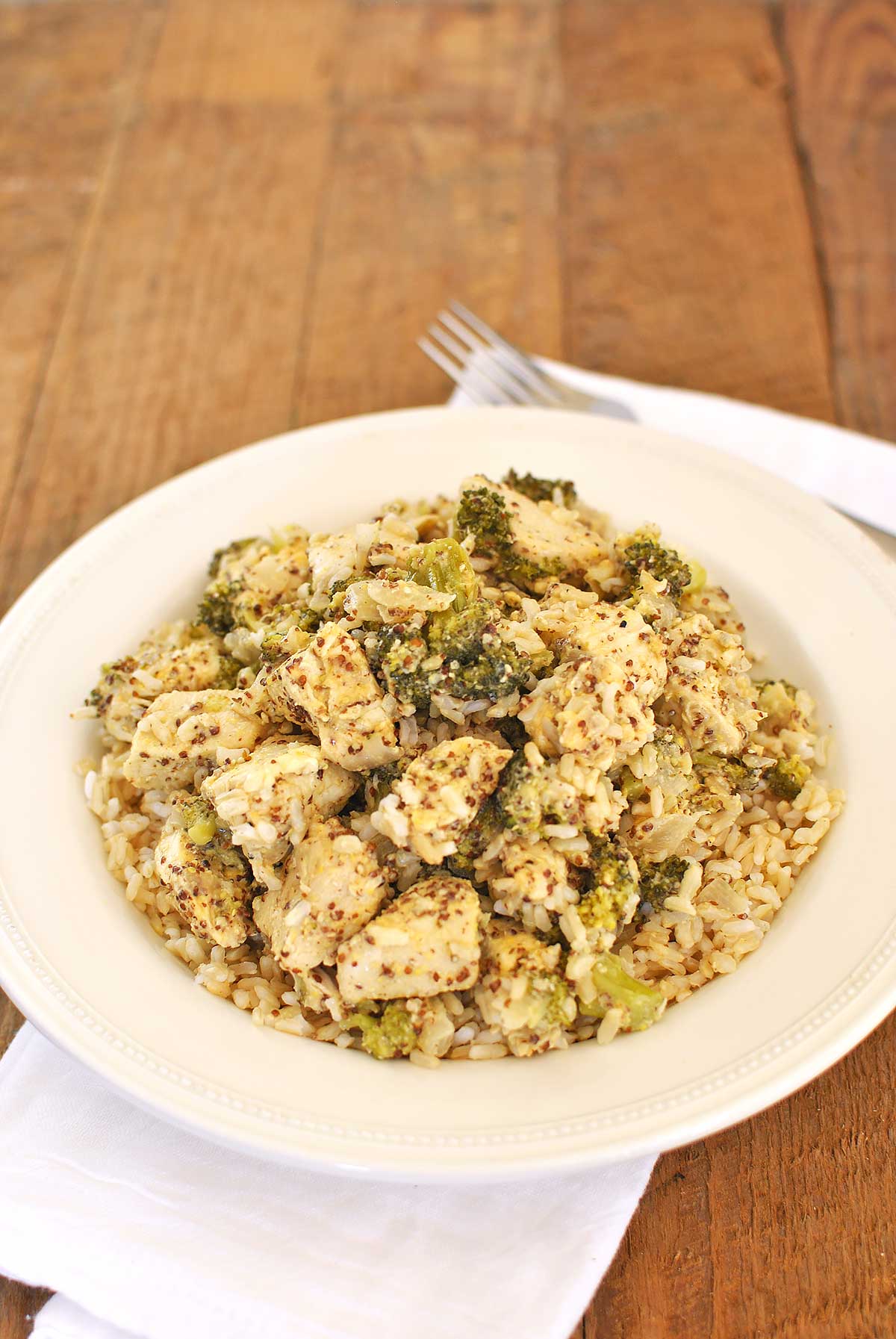 Weeknight Chicken Divan with Rice helps busy cooks put dinner on the table in 30 minutes. All you need are pantry staples like broccoli, chicken, dijon mustard & cheddar cheese to make this dish happen. No trip to the store needed and a dinner that tastes and sounds fancy is done. Becky's Best Bites