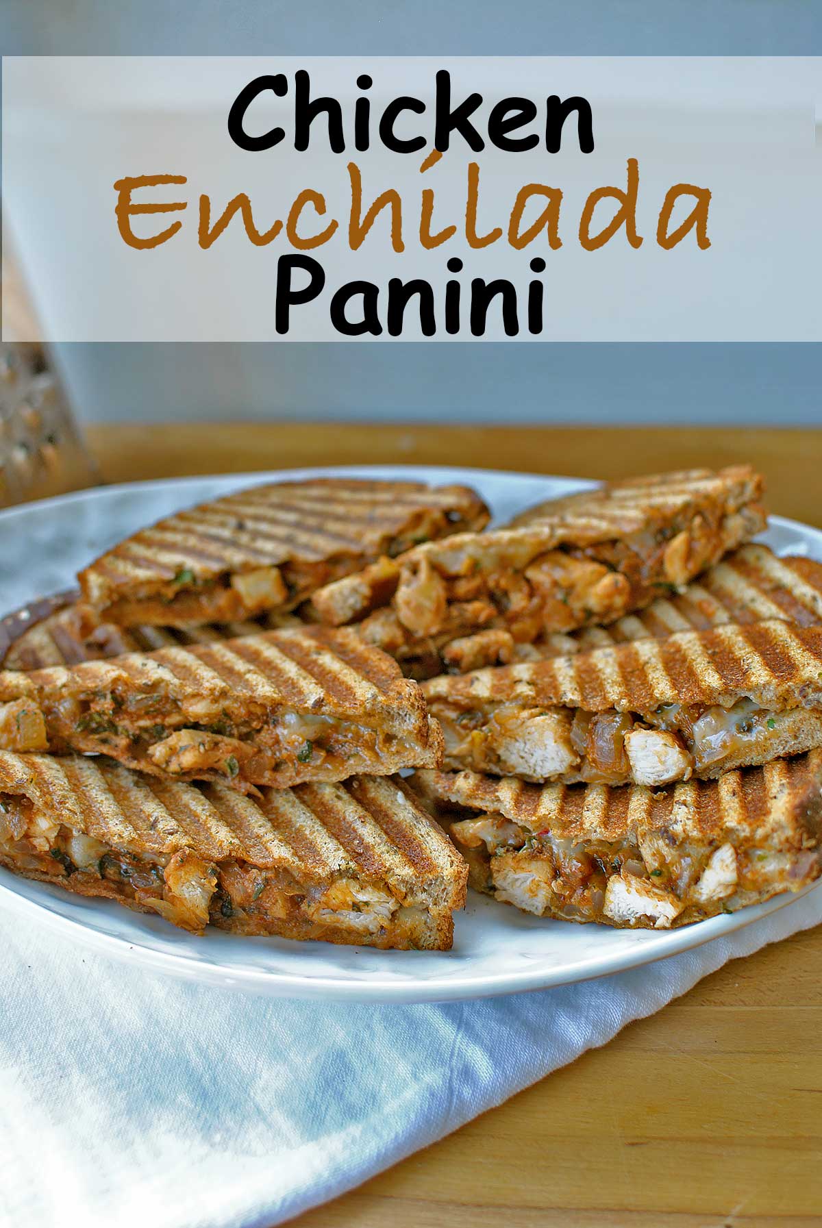 Chicken Enchilada Panini is a warm toasty fusion of melty grilled cheese stuffed with chicken smothered in a smoky homemade and a bit spicy enchilada sauce. Southwest flavors and spicy pepper jack cheese come together in a warm ooey gooey sandwich for a quick and easy dinner that will make everyone smile :) Becky's Best Bites