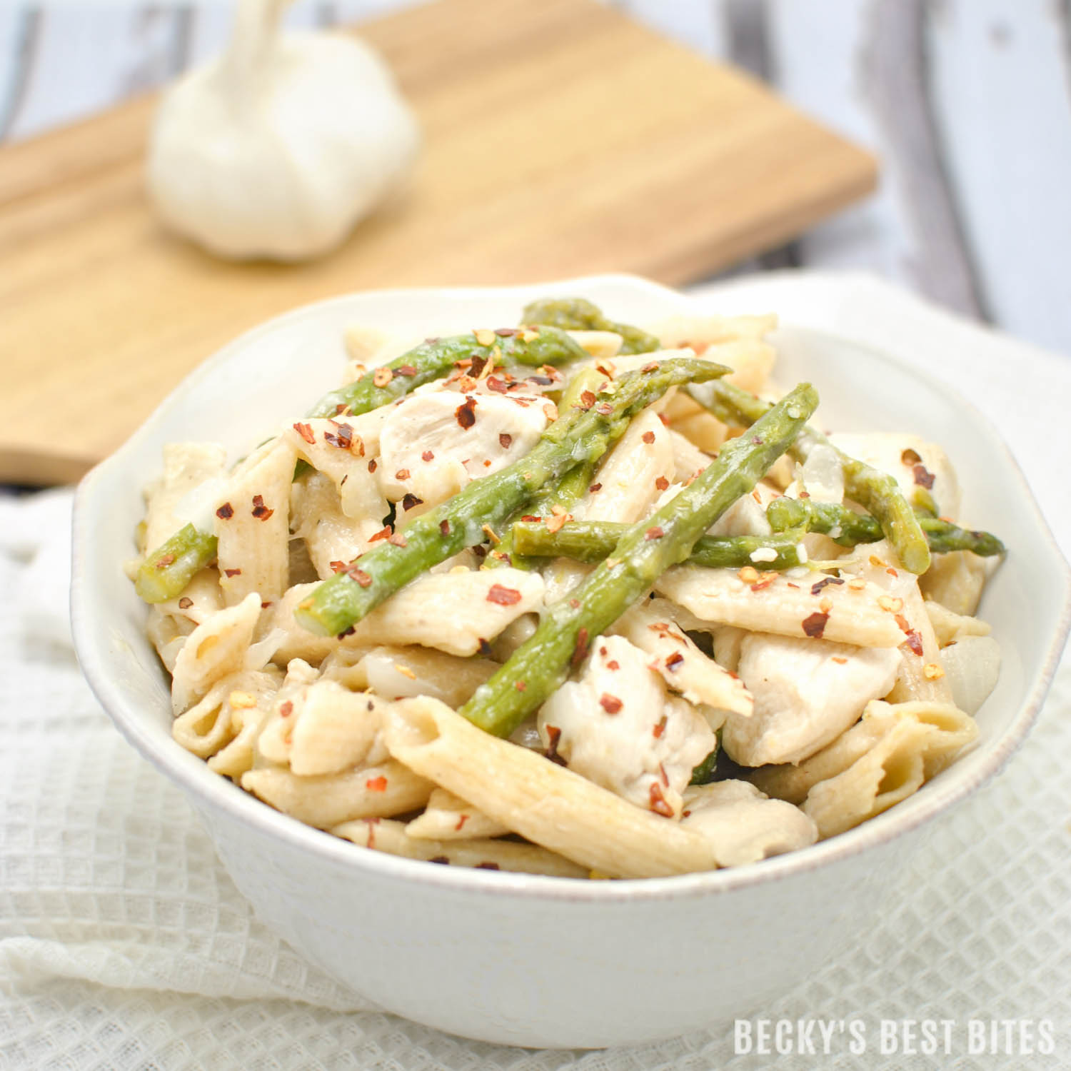 Easy Lemon Garlic Chicken Pasta with Asparagus is a healthy, weeknight dinner recipe with fresh spring flavors for a meal that the whole family will love! | beckysbestbites.com
