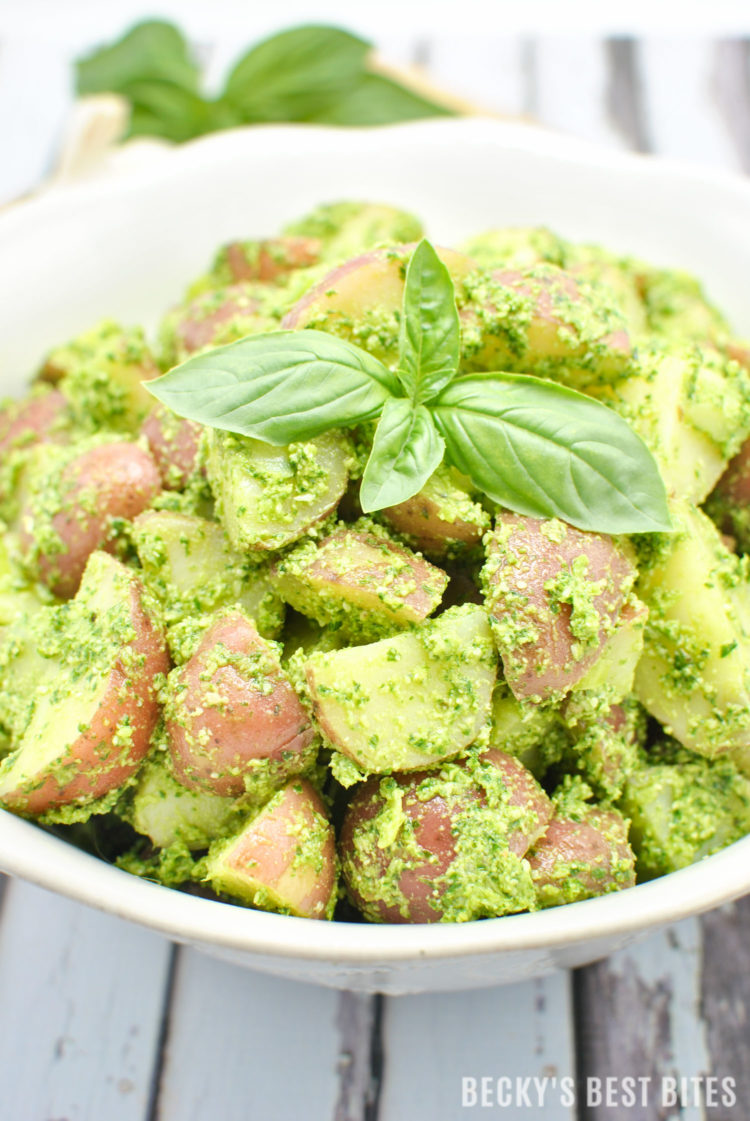 Summer Pesto Potato Salad is a healthy side that is perfect for any BBQ, cookout or other outdoor entertaining or party that you are having this holiday weekend. Impress your guests with this easy dish that is sure to please! | beckysbestbites.com