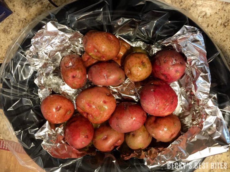 Slow Cooker Apple, Roasted Garlic & Herb Pork Loin with New Potatoes | beckysbestbites.com