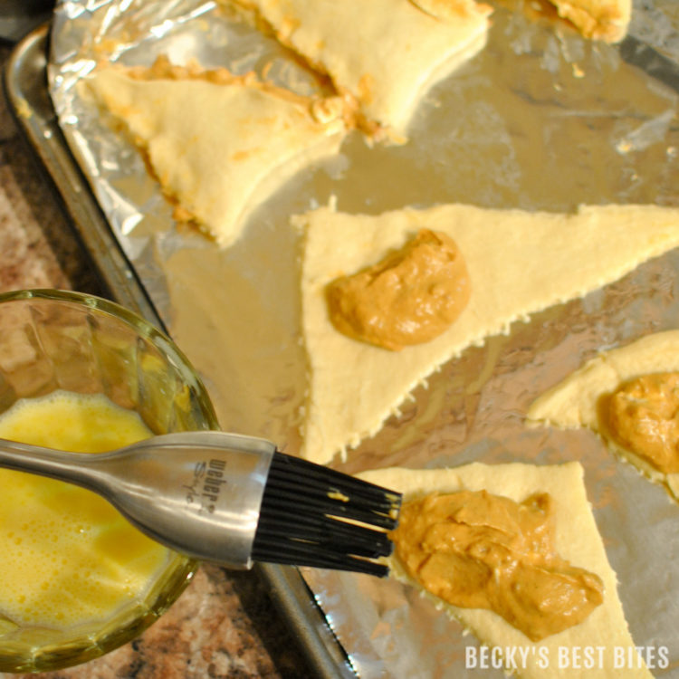 #ad Creamy Baked Pumpkin Pie Empanadas is healthier and easy dessert recipe perfect for Holiday entertaining made with a trusted brand, Pillsbury Crescent Rolls. They are mini kid-approved treats with all the flavors of the fall season and pumpkin pie while saving time to spend with family. #ItsBakingSeason | beckysbestbites.com