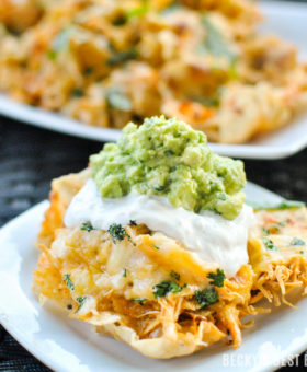 Slow Cooker Buffalo Chicken Nachos with Greek Yogurt Blue Cheese Dip & Quick Guacamole is a quick and easy appetizer or party snack! Make it into a weeknight meal by ditching the chips and serving over rice, on a pizza or in lettuce wraps. | beckysbestbites.com