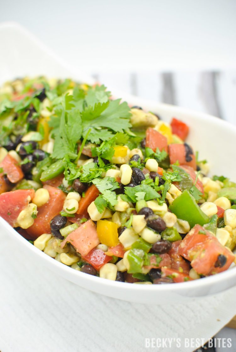 Southwest Black Bean and Corn Salad / Salsa is a beautiful, quick and easy side dish for grilled meats. Use as an healthy appetizer for a game day spread. | beckysbestbites.com