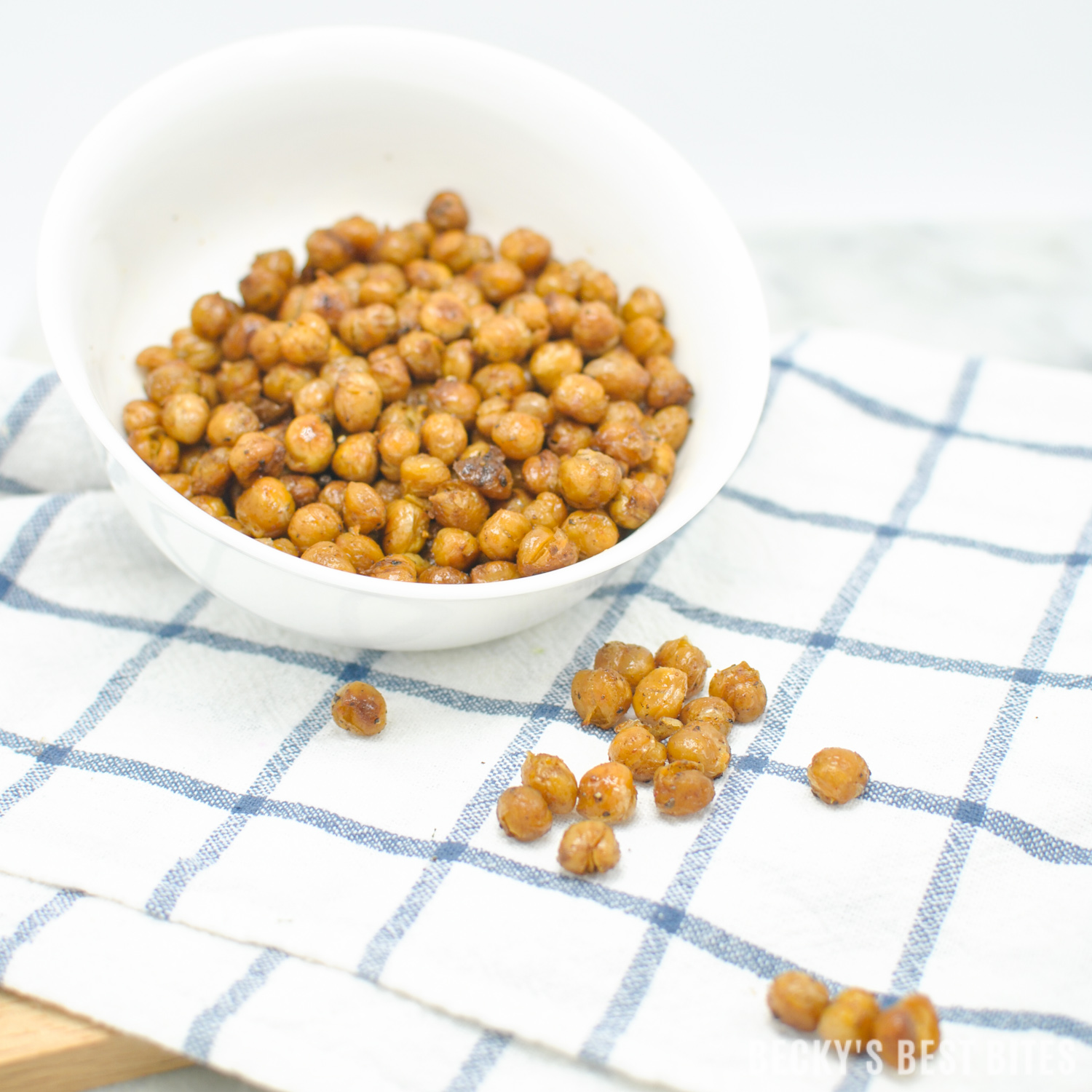 Easy Oven Roasted Chickpeas are a low calorie, protein and fiber rich snack or a nutritious crunchy topping for your favorite salad. | beckysbestbites.com