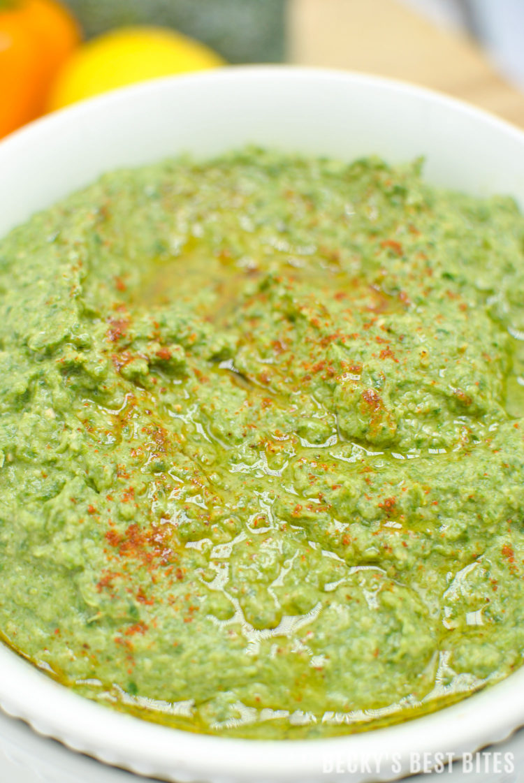 Green Goddess Spinach Hummus is a quick, easy and healthy appetizer or snack recipe perfect for a game day or tailgate spread. Pair it with chopped veggies or homemade pita bread or add it to wraps or sandwiches for an added nutritional boost. | beckysbestbites.com