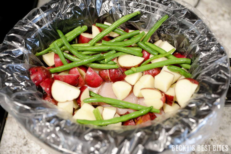 Slow Cooker Greek Chicken with Potatoes and Green Beans is an easy and healthy recipe perfect for a weeknight family meal.  You only need 10 minutes of morning prep and dinner will be waiting when you get home that evening :) | beckysbestbites.com