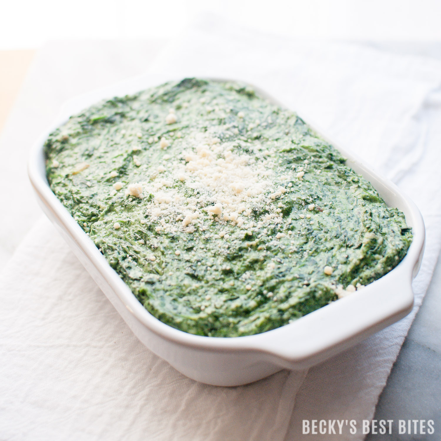 Easiest Creamed Spinach is a quick, 5 ingredient, holiday side dish recipe. Spend more time making memories and less time in the kitchen this holiday season by focusing on the ease and convenience of simple recipes for your family meals. #DairyPureandSimpleHolidays #ad | beckysbestbites.com