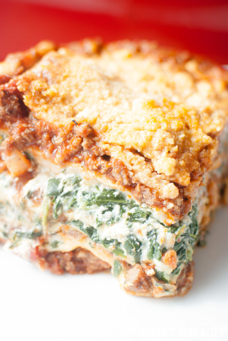 Meat & Veggie Lovers Family Lasagna is the perfect recipe to please a crowd! Ground beef and sausage pair beautifully with garlic, onion, tomatoes, bell peppers and spinach to make a delicious freezer friendly & make ahead meal that will be requested time and time again. | beckysbestbites.com