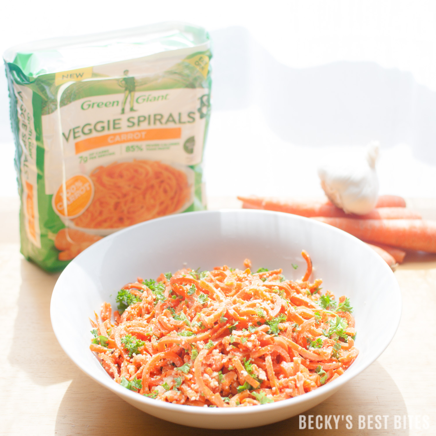 #ad Garlic and Parmesan Carrot Spirals are a colorful, delicious and healthy side dish recipe perfect for your next meal. For added protein and an easy family meal pair this dish with diced grilled chicken, beef, shrimp or pork for an easy dinner on the craziest of nights. #VeggieSwapIns #IC | beckysbestbites.com @greengiant @Walmart 